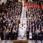 Archbishop of Paris, Laurent Ulrich leads clergy as they walk down the central isle of Notre-Dame Cathedral at the end of a ceremony to mark the re-opening of the landmark cathedral, following the 2019 fire, in Paris, December 7, 2024. LUDOVIC MARIN/Pool via REUTERS